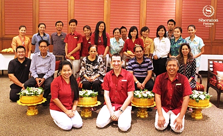 Management, staff and associates of the Sheraton Pattaya Resort participated in the Songkran celebrations to pray and present alms to monks and to gently pour fragrant lustral water adorned with roses and jasmine flowers over the Buddha image. The staff also poured water on the hands of revered elders such as Om Parkash Bajaj, the hotel’s owner (second row, left), Michael Delargy, General Manager (centre front) and Rojjana Franzke, Executive Assistant Manager (left front) who in turn gave them their blessings.